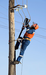 Image showing Electrician working at height