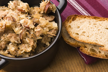 Image showing traditional polish sauerkraut (bigos) with mushrooms and plums