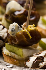 Image showing Appetizer Plate with Dactyl, Pecan nuts and Cheese