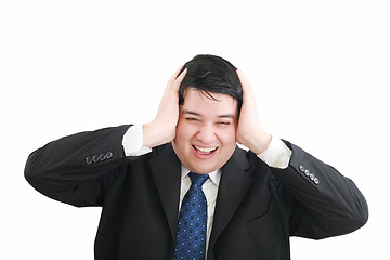 Image showing Frustrated young businessman pulling his hair, studio shot 
