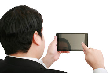 Image showing Businessman holding a blank touchpad pc, one finger touches the 