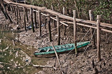 Image showing old row boat in mud