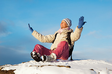 Image showing woman sitting outdoors and enjoy the Sun