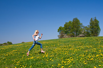 Image showing happy young woman on meadow