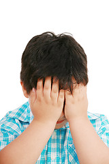 Image showing Very cute little boy with sad expression and hands on face 