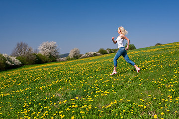 Image showing happy young woman on meadow