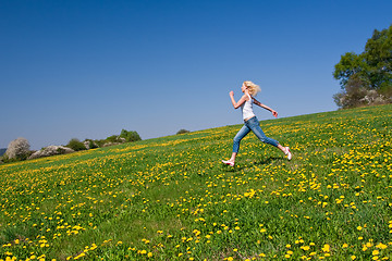 Image showing happy young woman on meadow