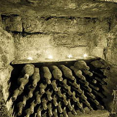 Image showing wine bottles with candles