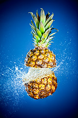 Image showing Pineapple splashed with water