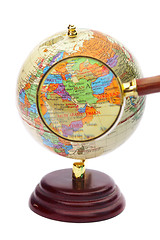 Image showing Iran, Iraq and Afghanistan on the globe under a magnifier. 