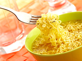 Image showing Hot and tasty noodles on a plug.