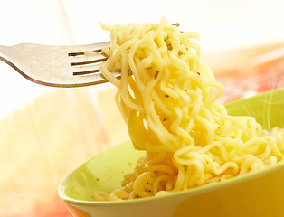 Image showing Hot and tasty noodles on a plug.