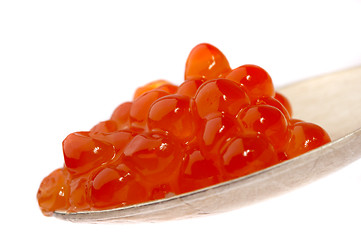 Image showing Red caviar on the spoon, on a white background 