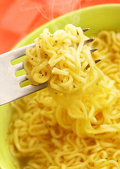 Image showing Hot and tasty noodles on a plug.