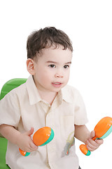 Image showing boy with maracas, isolated on white