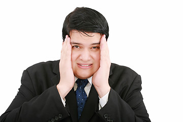 Image showing Close-up of a businessman with a migraine holding his temples.