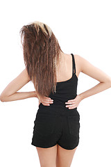 Image showing Closeup of young woman suffering from back pain 