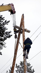 Image showing Electrical work at the height of winter
