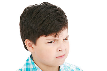 Image showing Close-up portrait of angry little boy isolated on white backgrou