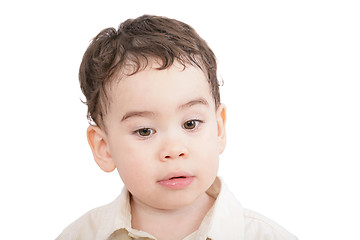 Image showing little boy, child looking down isolated on white 