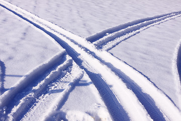 Image showing tire tracks in the snow in winter