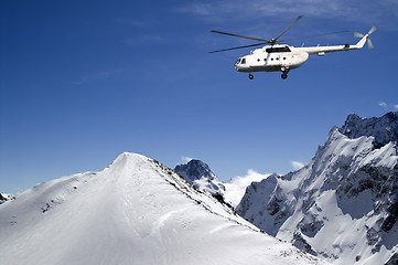 Image showing Helicopter in snowy mountains