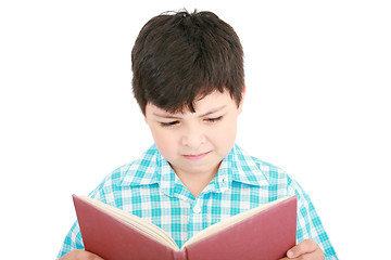 Image showing Small boy reading a book on a white background 