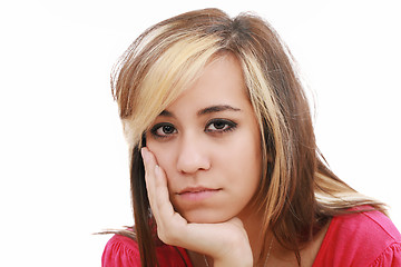 Image showing studio portrait of sad young attractive woman 