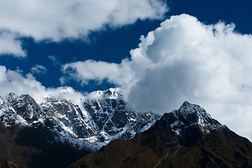 Image showing Snowed up mountain range and clouds in Himalayas