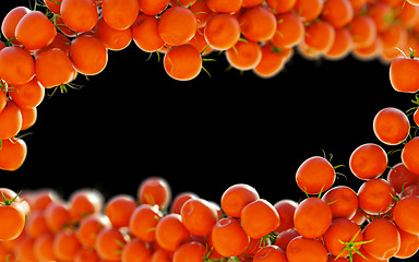 Image showing Tasty red tomatoes flow over black