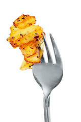 Image showing Fried potatoes  on  a fork