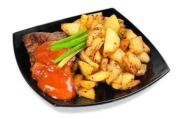 Image showing Grilled meat and  fried  potatoes  on a plate