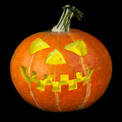 Image showing A scary old jack-o-lantern on black.