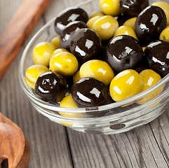 Image showing Olives on a wooden table