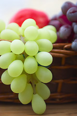 Image showing Red and white grape branch in a basket