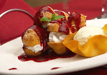 Image showing Tasty profiteroles on a dining table 