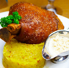 Image showing Pork leg with sauce, greens and cabbage 