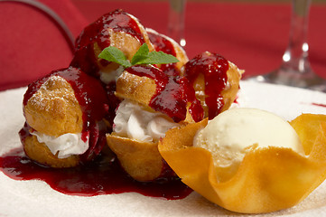 Image showing Tasty profiteroles on a dining table