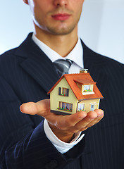 Image showing Hand of the businessman with the house