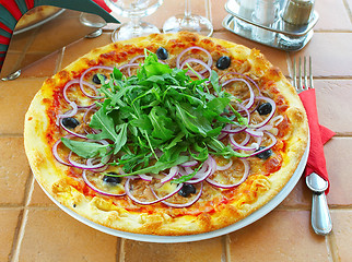 Image showing Hot pizza on a table in cafe 
