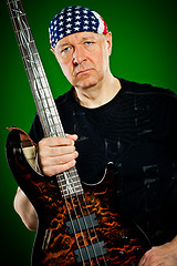 Image showing man with a guitar, bass player