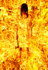 Image showing girl with an axe in a fiery flame. on pain of death