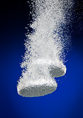 Image showing Effervescent tablets in water with bubbles