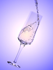 Image showing White Wine being poured in a wine glass