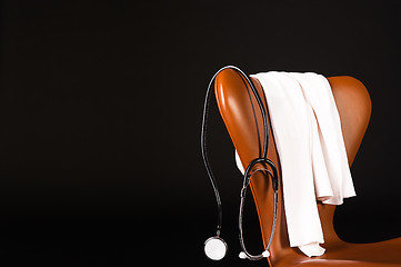 Image showing Stethoscope hanging over chair