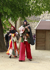 Image showing Troubadours on stilts