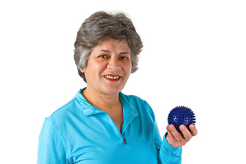 Image showing Female senior holding massage ball