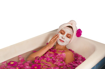 Image showing beautiful woman enjoying floral bath