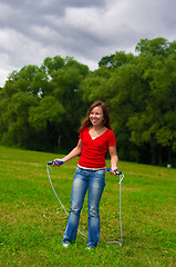 Image showing Young woman with skipping rope