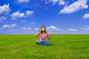 Image showing girl blowing soap bubbles